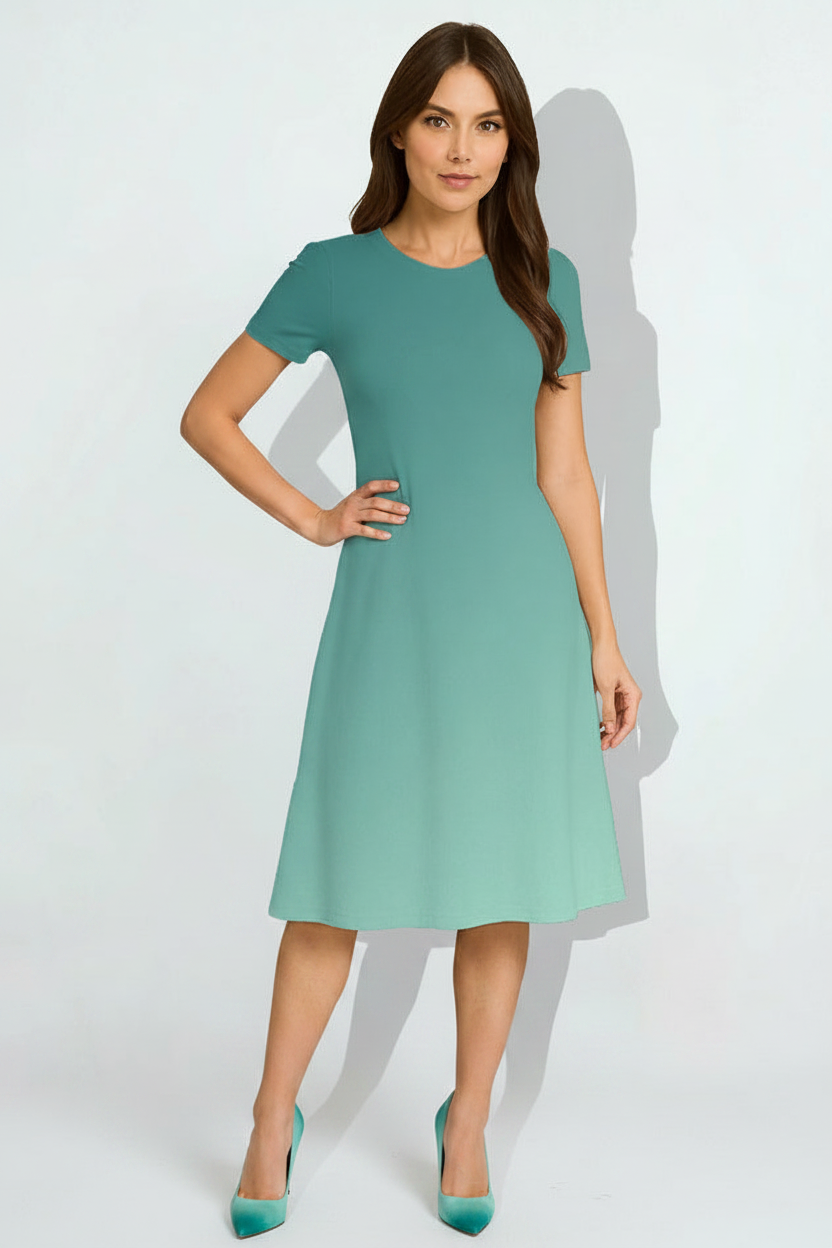 Indian female model wearing Aqua Mist Gradient Dress in studio setting, confident hand-on-hip pose, full body shot