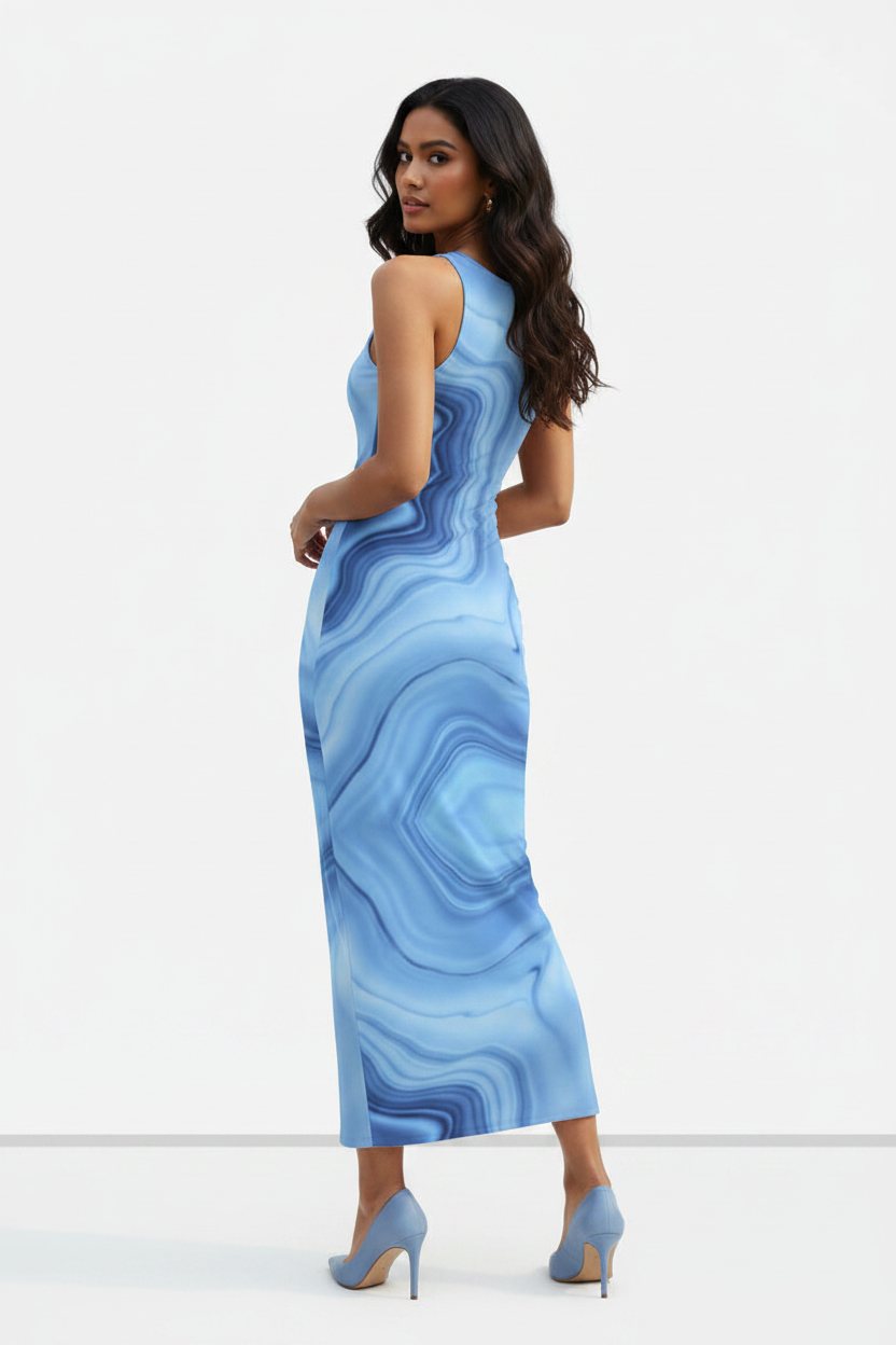 Azure Flow Bodycon Dress - wheatish-toned Indian female model wearing soft blue fluid abstract pattern bodycon dress, white heels, white studio background