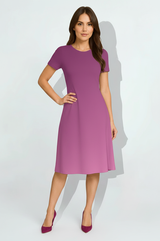 Indian female model wearing Royal Plum Ombre Dress in studio setting, confident hand-on-hip pose, full body shot