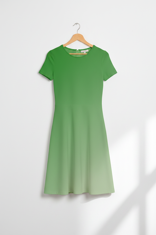 Sage Meadow A-Line Dress hanging on a light birch wood hanger, clean minimal white background, product-only shot