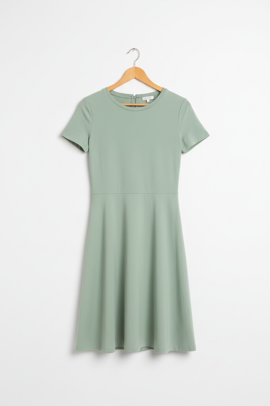 Sage green A-line dress on wooden hanger