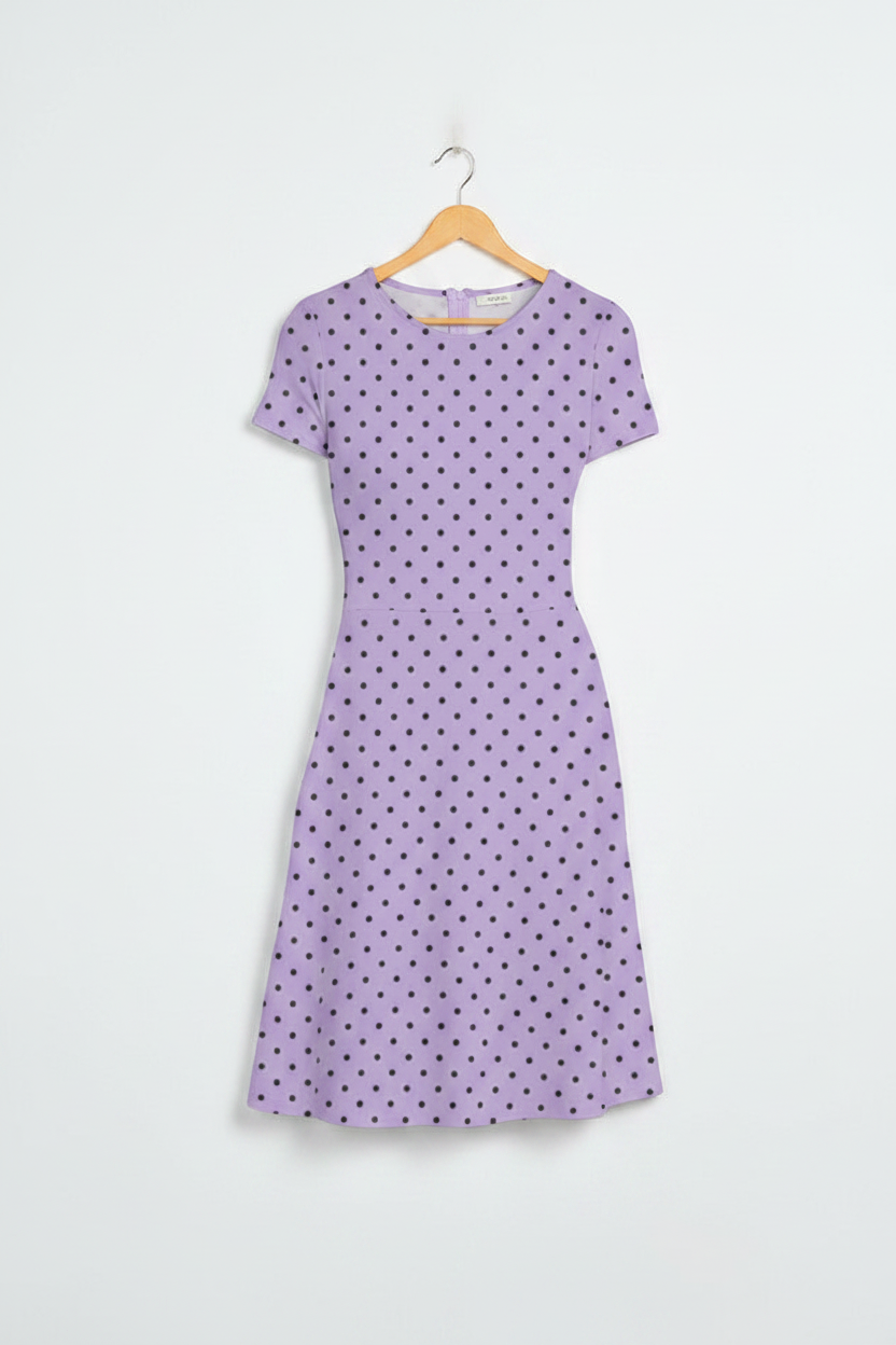 Lilac Elegance Polka Dress - dress on wooden hanger, white studio background