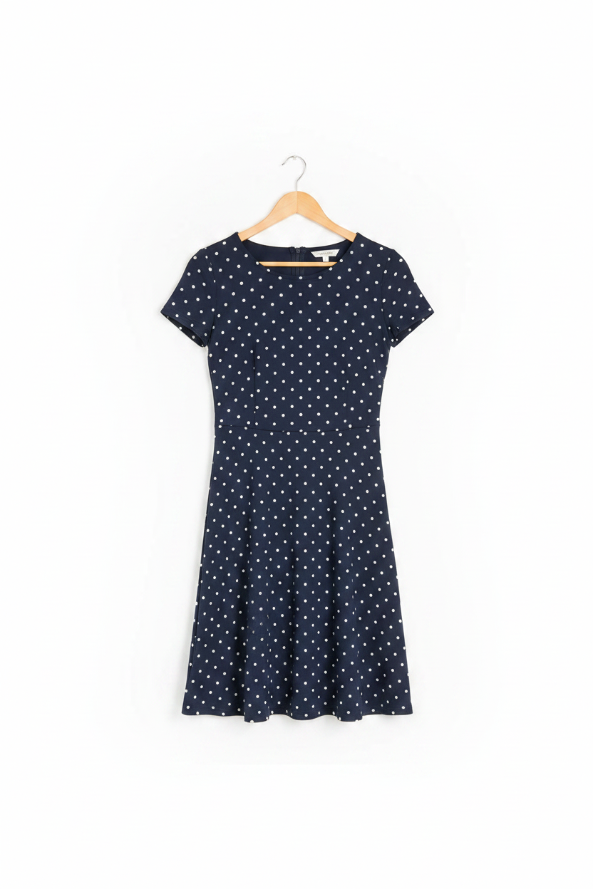 Midnight Blue Polka A-Line Dress - dress on wooden hanger, white studio background