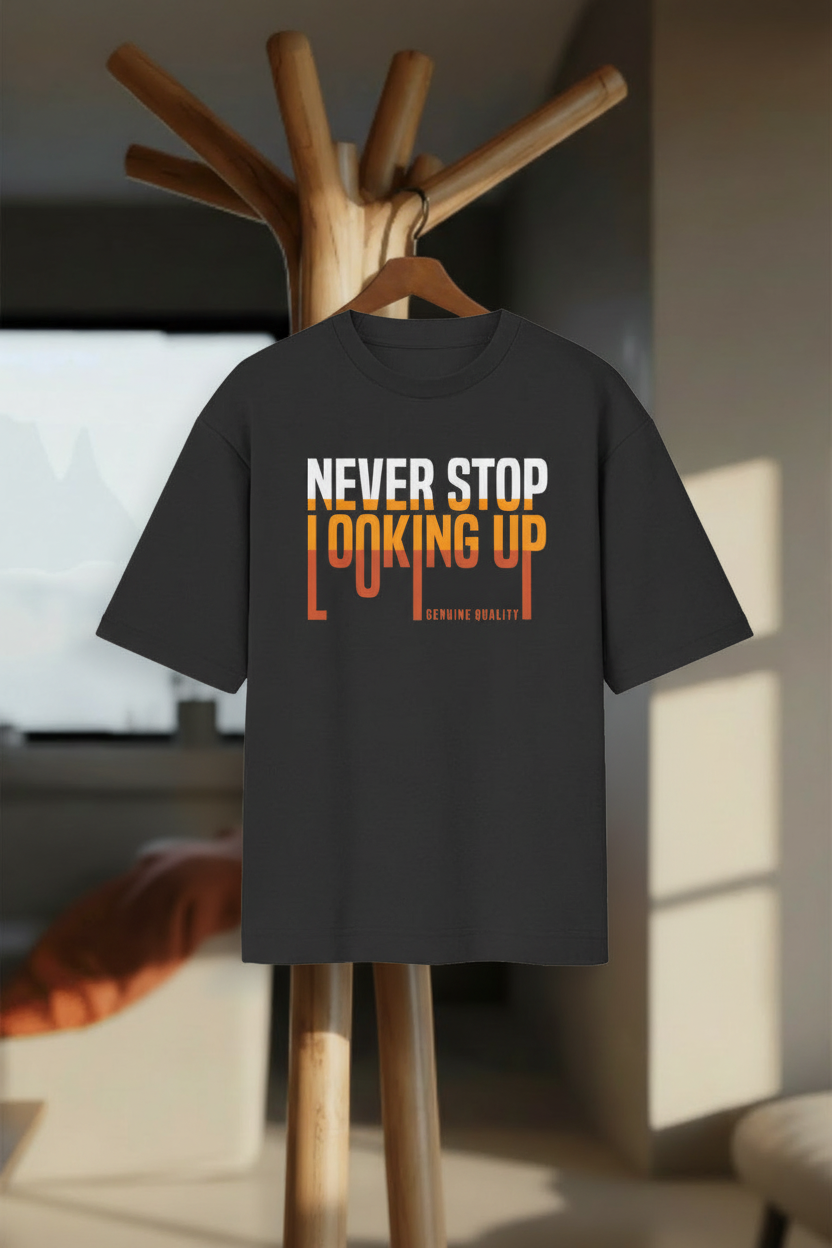 Never Stop Looking Up – Oversized Standard T-Shirt - Hanger Mockup