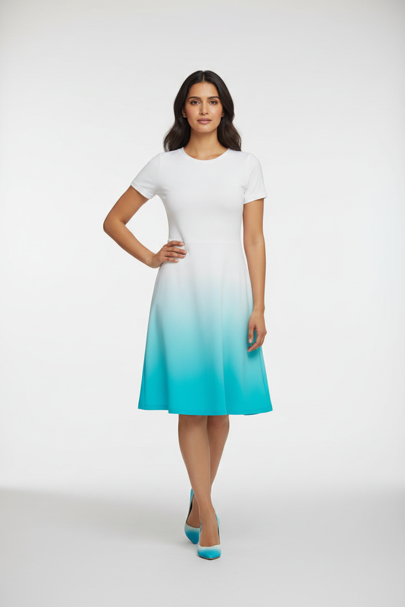 Indian female model wearing Azure Glow Gradient Dress in studio setting, confident hand-on-hip pose, full body shot