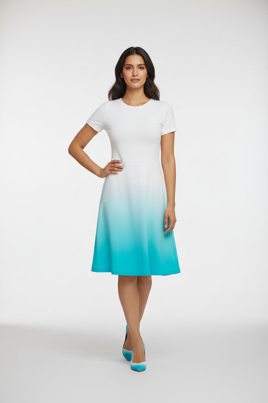 Indian female model wearing Azure Glow Gradient Dress in studio setting, confident hand-on-hip pose, full body shot